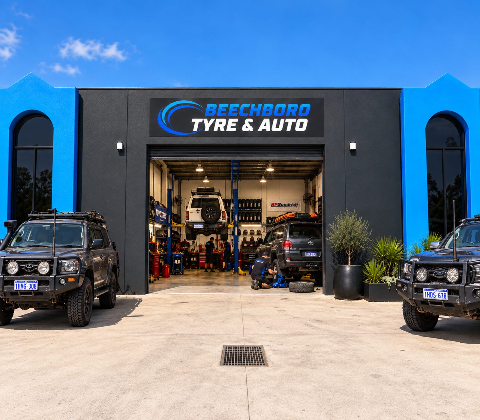 The Beechboro Tyre & Auto workshop at 56 Beringarra Ave, Malaga, with the roller door open and cars on the hoists